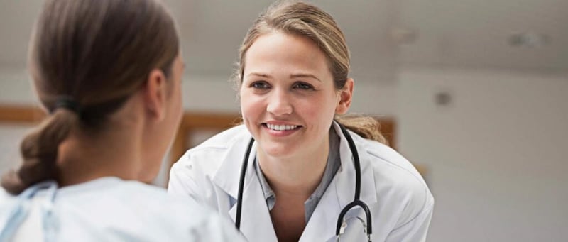 Female doctor speaking with patient